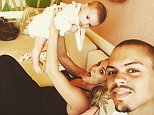 Evan Ross with wife Ashlee Simpson as she lifts up baby Jagger Snow