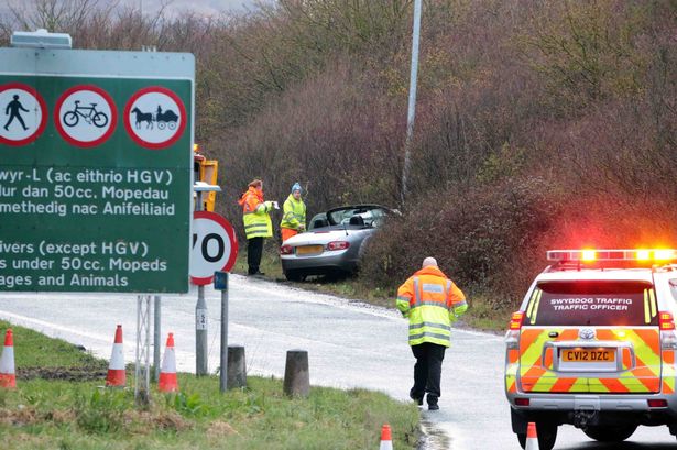 Woman in A55 crash cut free from car