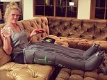 Holly Holm relaxes in compression boots as champion prepares for Miesha Tate fight