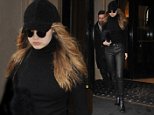 Gigi Hadid steps out in leather trousers as she continues Paris Fashion Week jaunt 