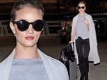 Rosie Huntington-Whiteley is model perfect as she touches down at LAX