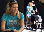 Make-up free Elyse Taylor glows as she steps out with two-year-old lookalike daughter Lila