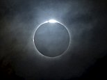 Dark side of the moon: Millions across the Pacific flock to see the only solar eclipse of 2016 as Asian countries are momentarily plunged into darkness