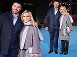 Pregnant Kristina Rihanoff covers up her bump in chic grey coat with Ben Cohen at Eddie The Eagle