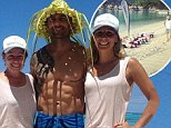 Steve 'Commando' Willis reveals his rippling abs while posing in a woven leaf hat as he leads a fitness training camp in Tahiti