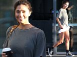 Pia Miller opts for minimal make-up as she displays her toned legs in understated denim shorts