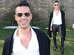Anthony Callea sports bizarre leather pants and unbuttoned shirt to Australian Grand Prix
