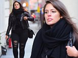 Ashley Graham keeps it causal and coordinated  in black as she rocks distressed jeans with a leather jacket