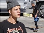 Justin Bieber hops on four wheels as he kills time before his concert in Arizona
