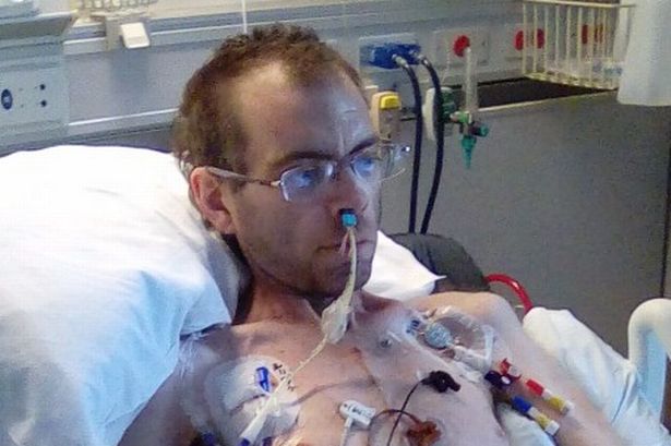 Anglesey man struck with life-threatening infection sits up in hospital bed for first time