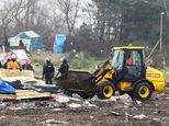 Migrants stand firm in calais as demolition teams continue work at the jungle