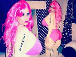 Katie Price channels rapper Nicki Minaj for NYE bash in buxom bodysuit and hot pink bikini…as she toasts to last night drinking for a year