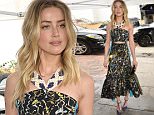 Amber Heard sports patterned cut-out dress at pre-Golden Globes luncheon
