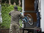 Movers continue unloading trucks at the Obamas new home