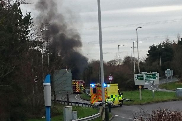 Car 'engulfed in flames' on A55 slip road