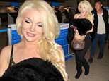 Courtney Stodden smiles while jetting out of LA