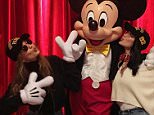 Bella and Gigi Hadid make kissy faces at Mickey Mouse