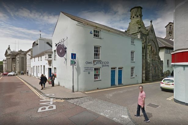 Caernarfon and Porthmadog tourist centres axed three months ago could be re-opened