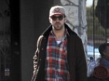 Ryan Gosling keeps it casual in flannel and jeans