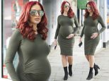 Ex TOWIE star Amy Childs shows off bump in tight dress