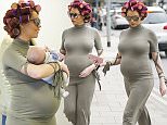 Pregnant Amy Child flaunts her bump as she dotes on baby