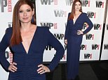 Debra Messing wows in body hugging navy gown for NYC gala