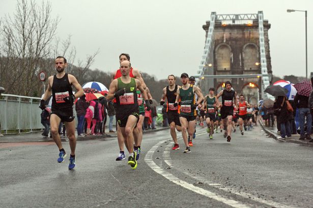 Watch Anglesey Half Marathon runners brave the wind and rain to take part in race