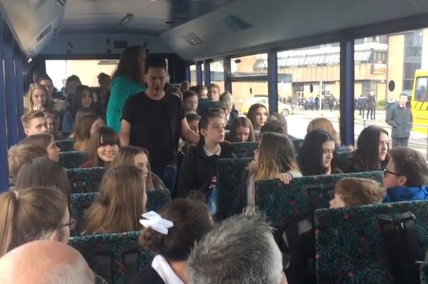 Watch operatic flash mob perform for Flintshire students on school bus