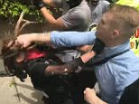 Supremacist 'caught on video punching a woman in the face'