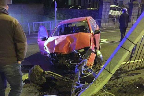 Driver arrested after car ploughs into railings in Caernarfon