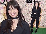 Busty Daisy Lowe teases flash of flat stomach at NY event
