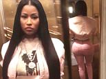 Nicki Minaj shows off famous booty in tight pink pants
