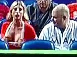 Orange-clad Marlins fan flashes the camera on tv
