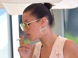 Bella Hadid smokes cigarettes in France