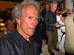 Clint Eastwood is mobbed by fans and signs autographs