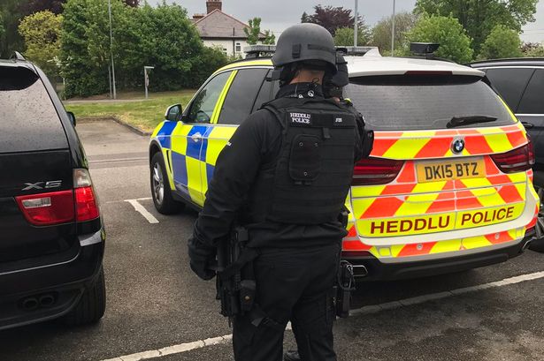 Armed police in Wrexham raid property and recover handgun