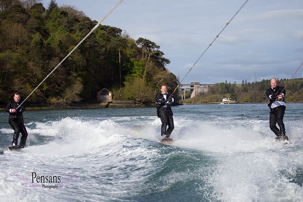 Groom arrives Bond style to own wedding… by wakeboarding along Menai Strait