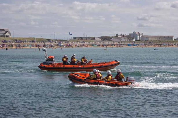 RNLI rush to rescue three after kayak and catamaran capsize off Anglesey