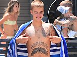 Justin Bieber frolics with a mystery girl in New York
