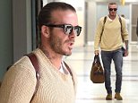 David Beckham shows off his man bun