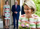 Queen Mathilde is a vision in a rainbow print dress