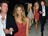 Robin Thicke's girl April Love Geary sizzles in mini-dress
