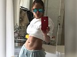 Jennifer Lopez, 47, flaunts her impressive abs