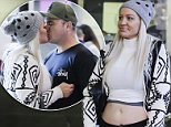Brynne Edelsten kisses 'fiancé' at Melbourne Airport