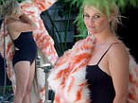 Reese Witherspoon wears fur coat and swimsuit for shoot