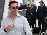 Hugh Jackman arrives at Melbourne Airport with family
