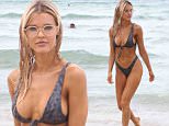 Joy Corrigan shows off her form during beach day in Miami