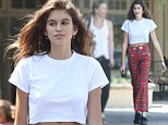 Kaia Gerber looks punk with plaid pants and safety pins
