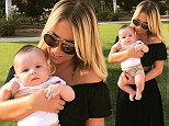 Kate Wright cuddles up to cute baby in revealing snap