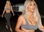 Kim Kardashian looks miserable in just a bra